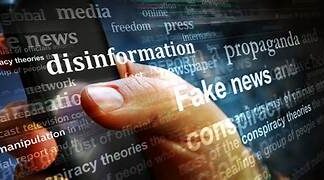 Digital Literacy and Civics Education are Essential Tools in Era of Disinformation and Surveillance Capitalism A finger touching a screen AI-generated content may be incorrect.