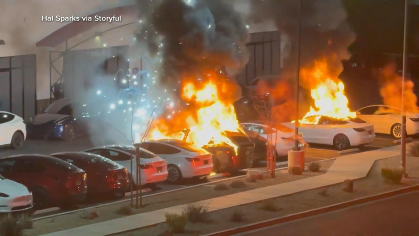 A group of cars on fire
AI-generated content may be incorrect.