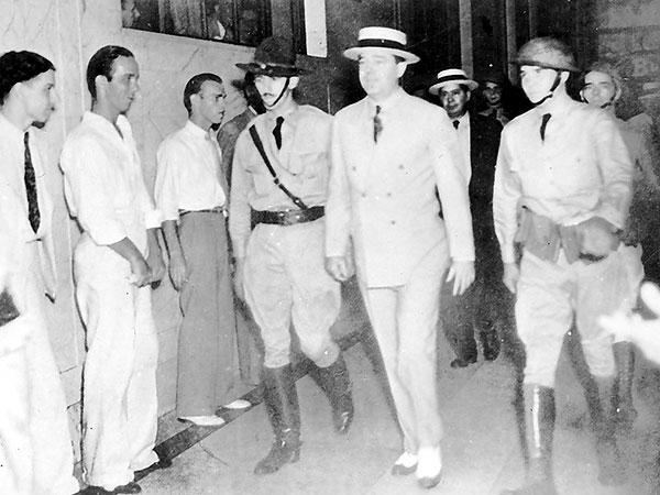 A group of men in military uniforms walking
Description automatically generated