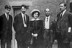 A group of people standing together
AI-generated content may be incorrect.