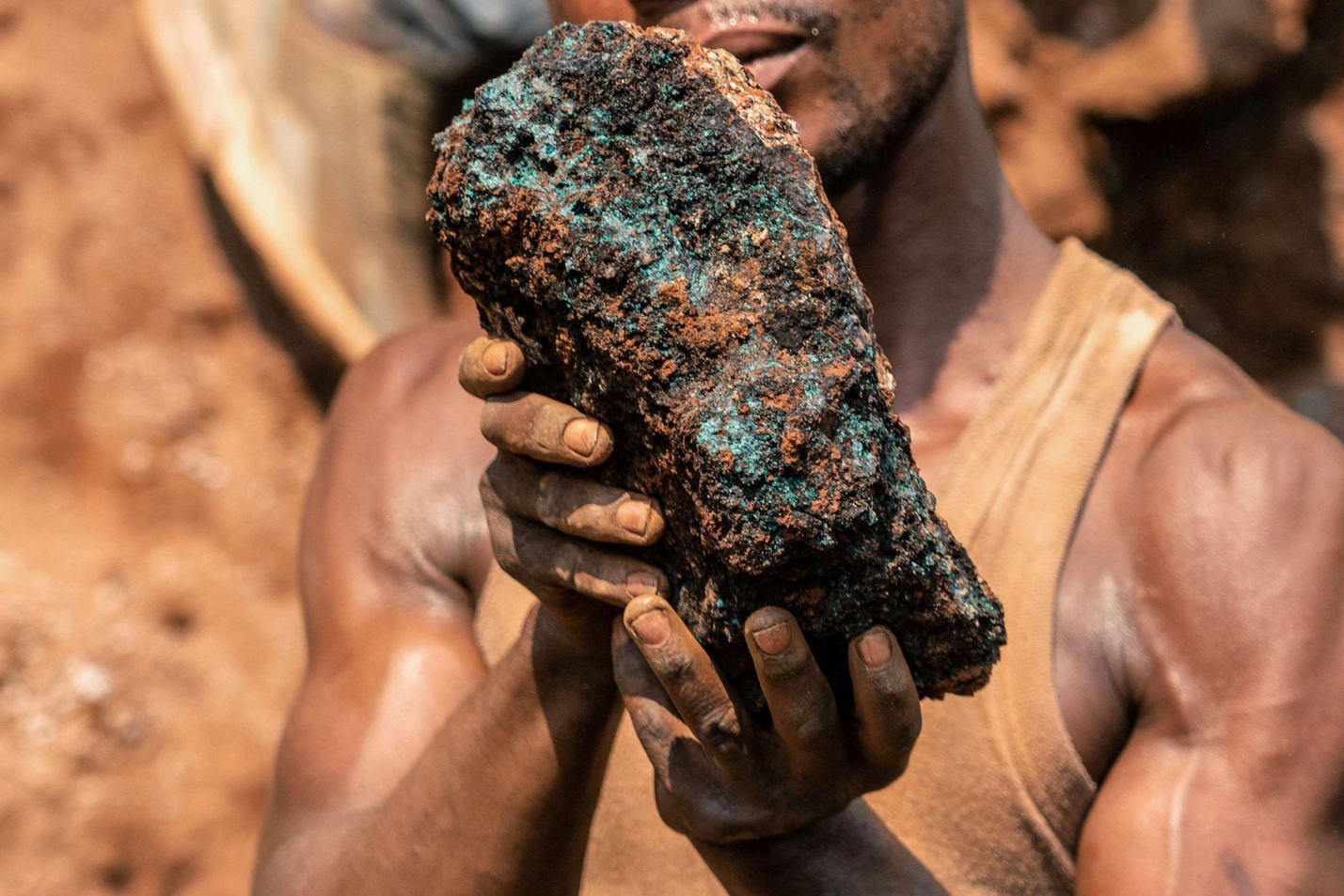 A person holding a large rock

AI-generated content may be incorrect.