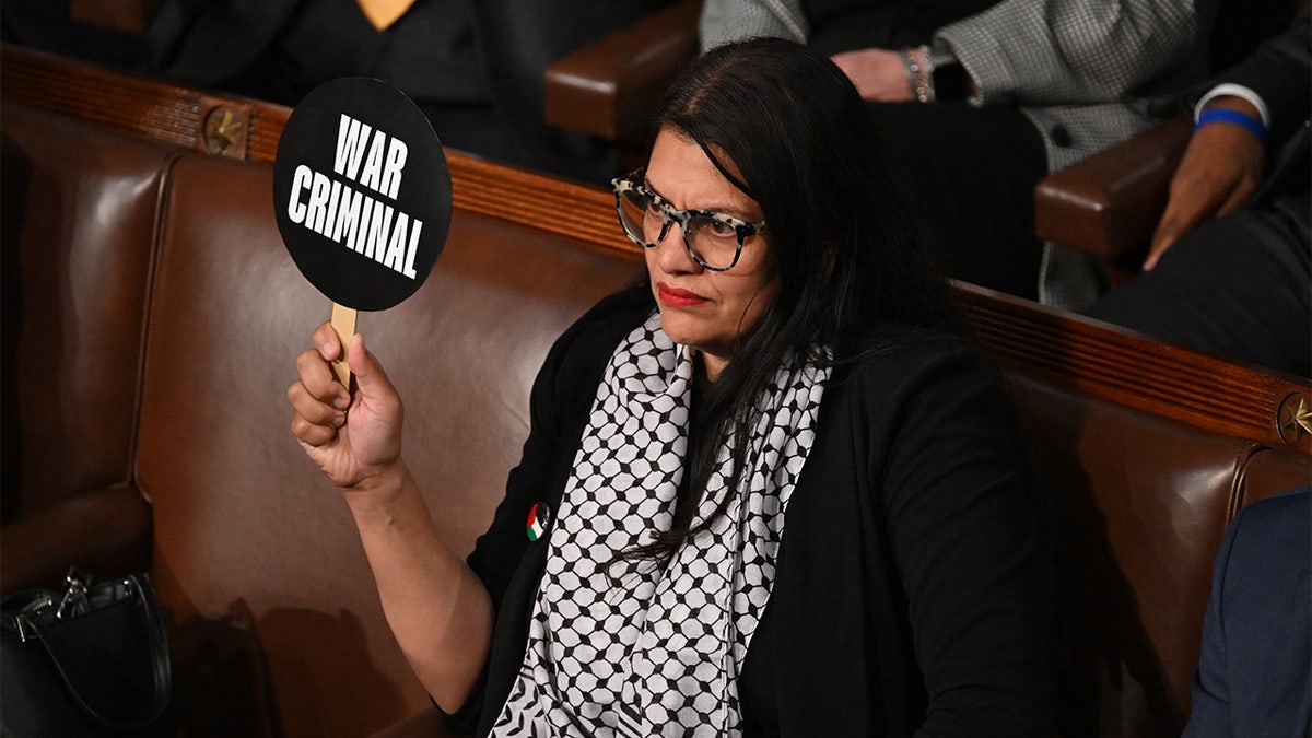 A person holding a sign

AI-generated content may be incorrect.