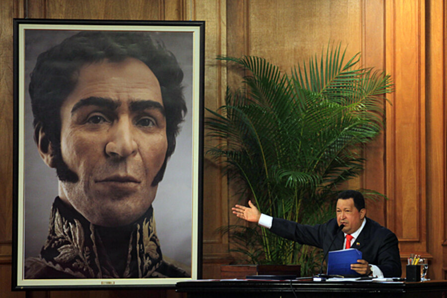 A person sitting at a desk in front of a picture of a person
AI-generated content may be incorrect.