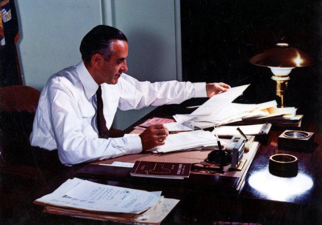 A person sitting at a desk with papers

AI-generated content may be incorrect.