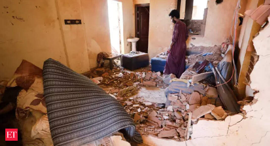 A person standing in a room with debris
AI-generated content may be incorrect.