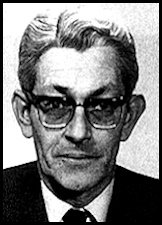 A person wearing glasses and a suit

AI-generated content may be incorrect.