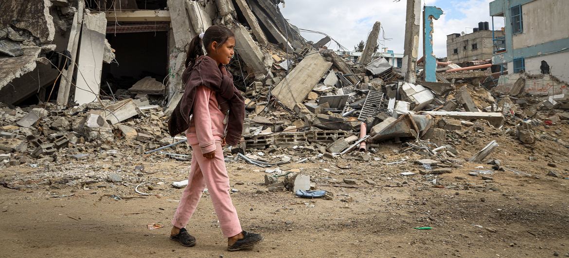 A young girl walks through destroyed streets in Khan Younis, in the southern Gaza Strip.