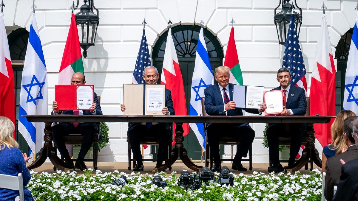 A group of men holding papers
AI-generated content may be incorrect.