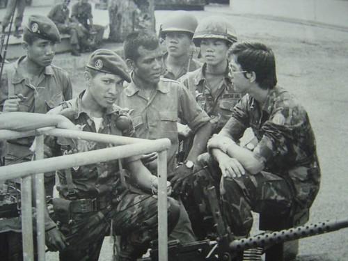 A group of men in military uniforms

Description automatically generated