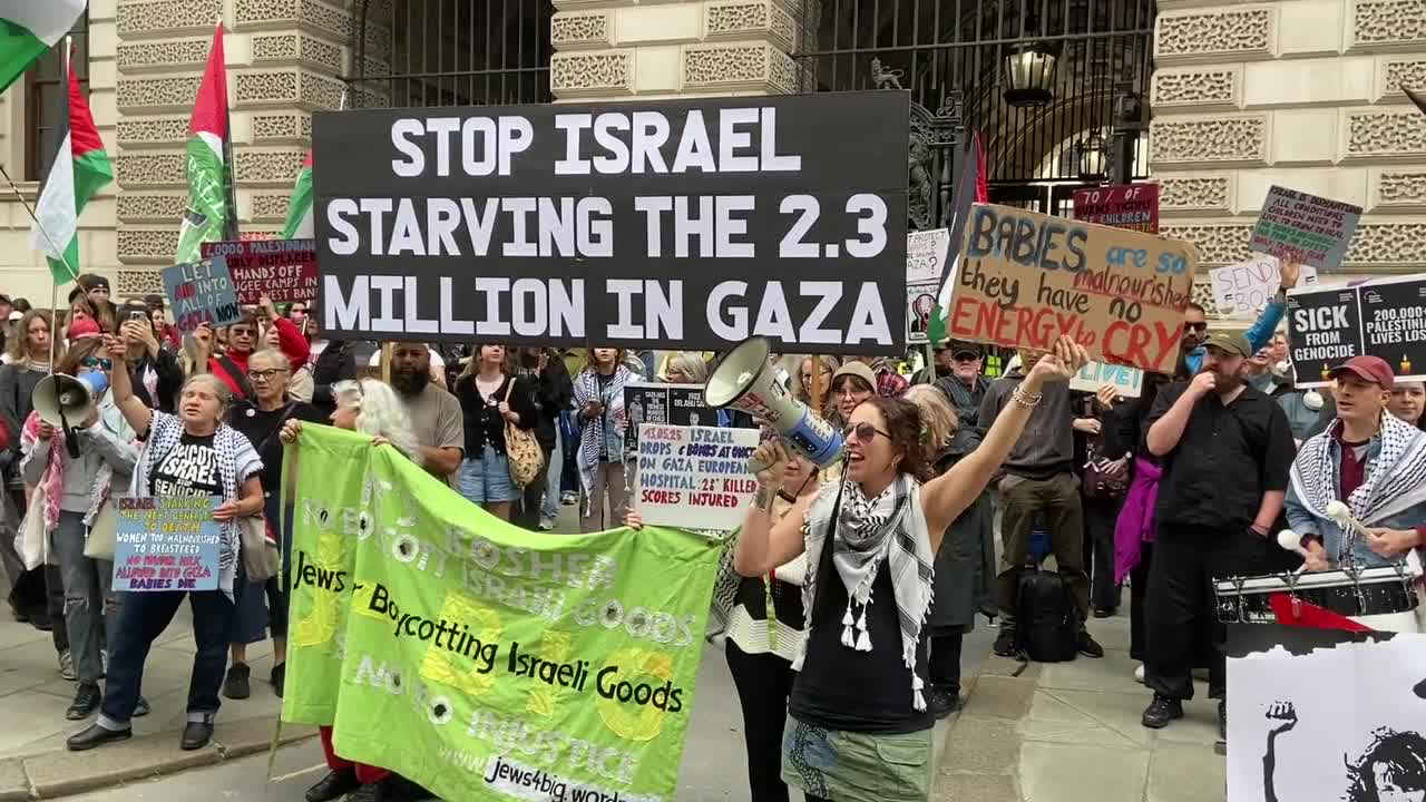 A group of people holding signs and a megaphone
AI-generated content may be incorrect.