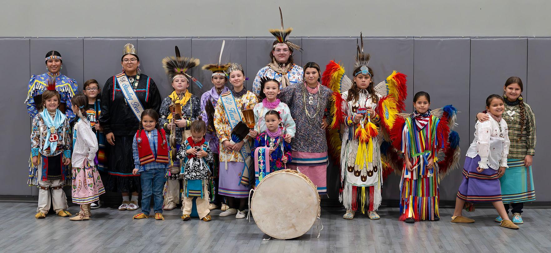 A group of people in traditional clothing
AI-generated content may be incorrect.
