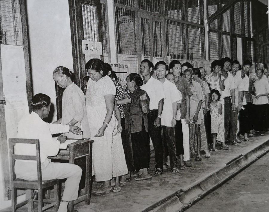 A group of people standing in a line

Description automatically generated