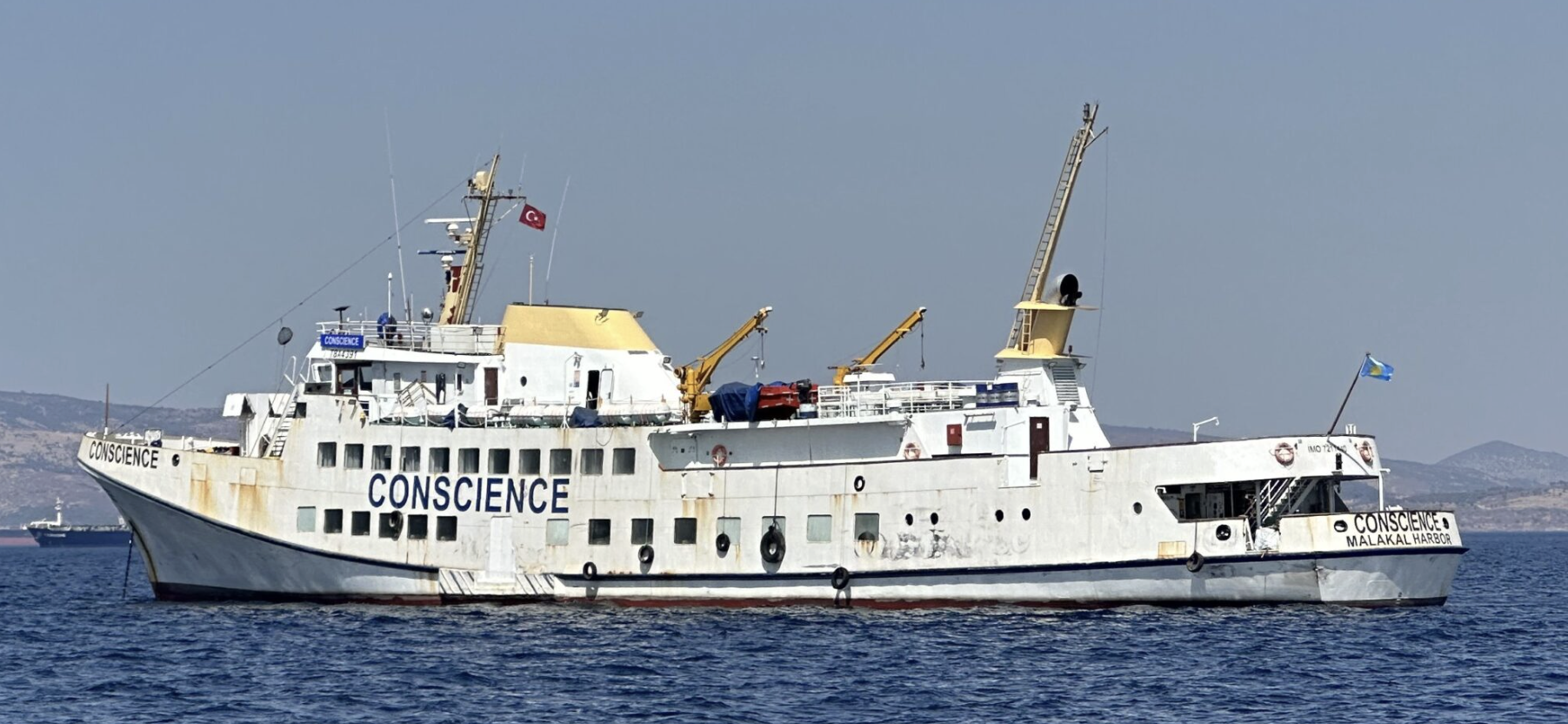 A large white boat in the water
AI-generated content may be incorrect.