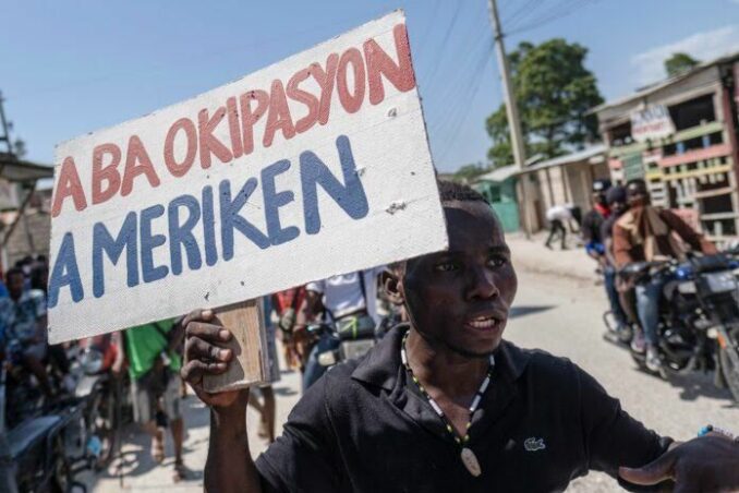 A person holding a sign
AI-generated content may be incorrect.