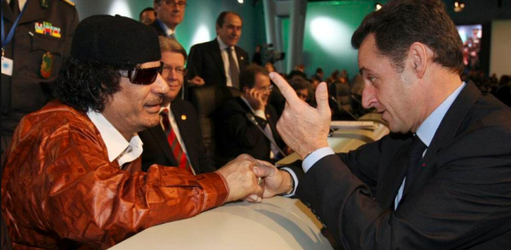A person in a black hat and sunglasses pointing at another person AI-generated content may be incorrect.