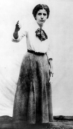 A person in a skirt and a scarf holding an object

AI-generated content may be incorrect.