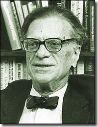 A person in a suit and bow tie

Description automatically generated