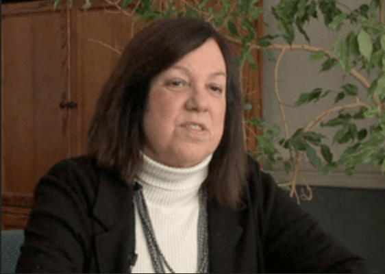 A person in a white turtleneck AI-generated content may be incorrect.