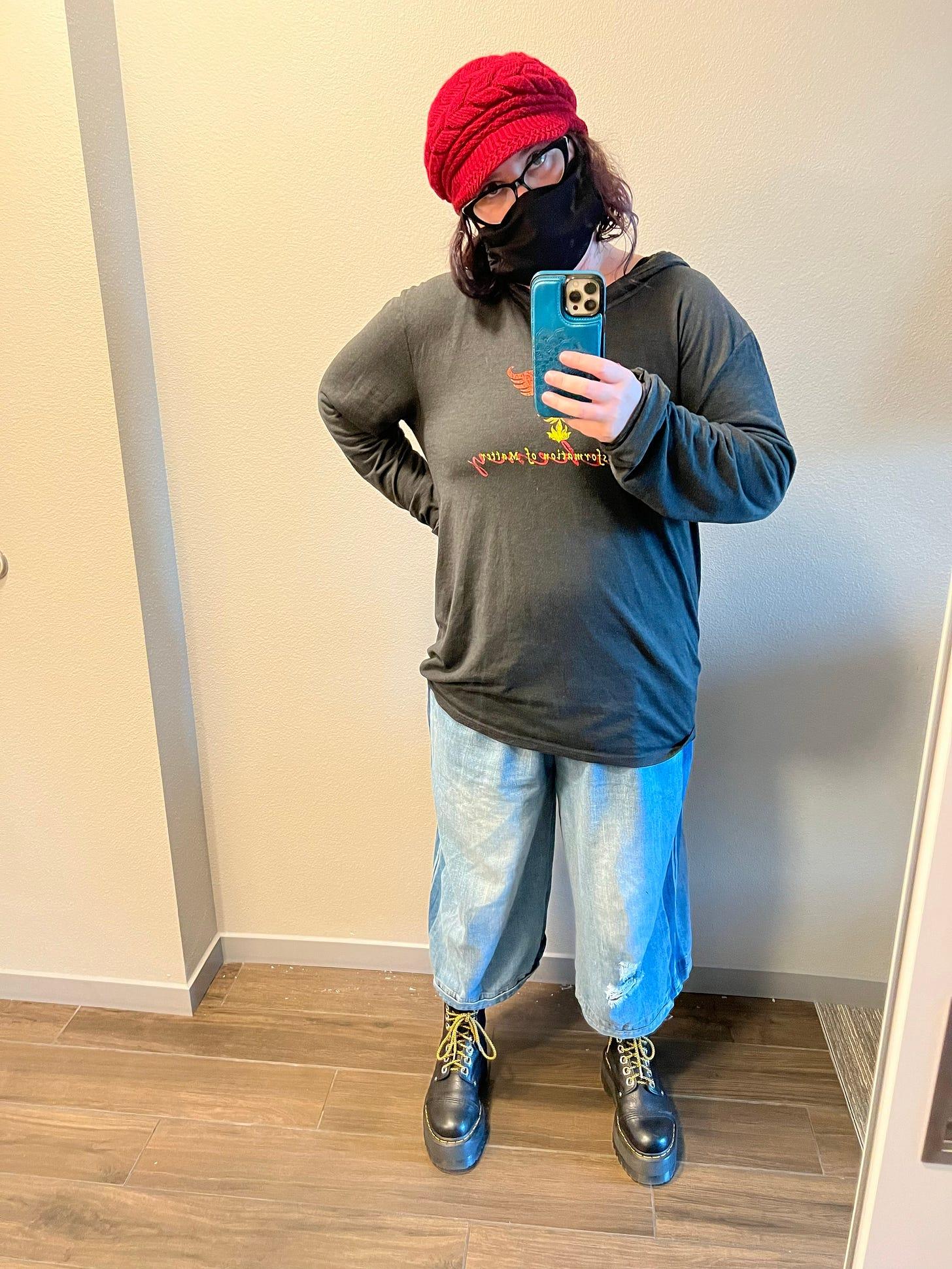 A person wearing a face mask and taking a selfie

AI-generated content may be incorrect.