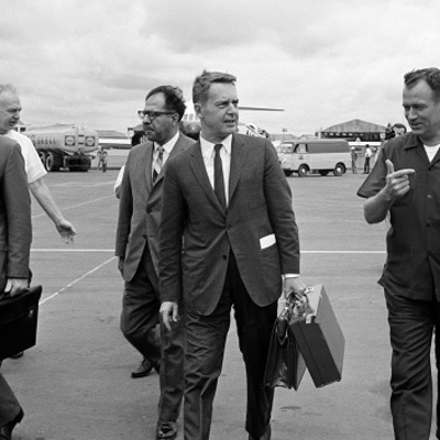 A group of men walking on a tarmac
AI-generated content may be incorrect.