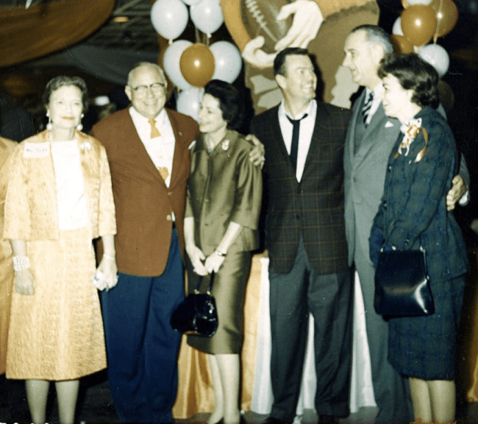 A group of people standing together Description automatically generated