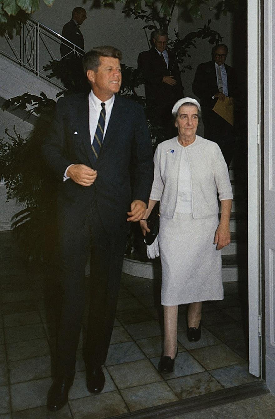 A person and person walking down a staircase

AI-generated content may be incorrect.