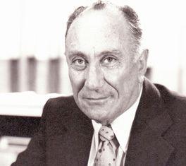 A person in a suit and tie

AI-generated content may be incorrect.