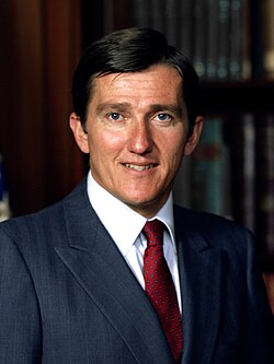 A person in a suit and tie
AI-generated content may be incorrect.