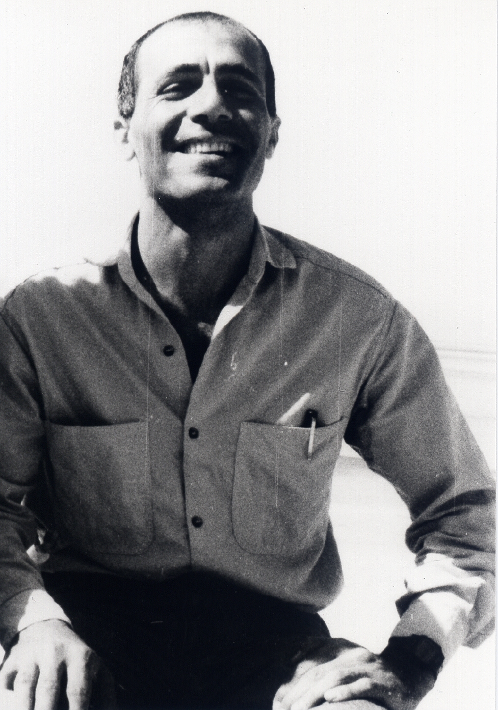 A person smiling with a pen in his pocket
AI-generated content may be incorrect.