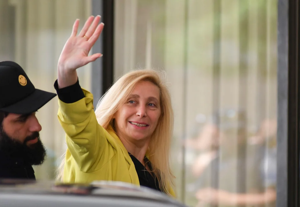 A person waving in front of a car
AI-generated content may be incorrect.