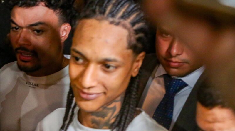 A person with a tattoo on his neck

AI-generated content may be incorrect.