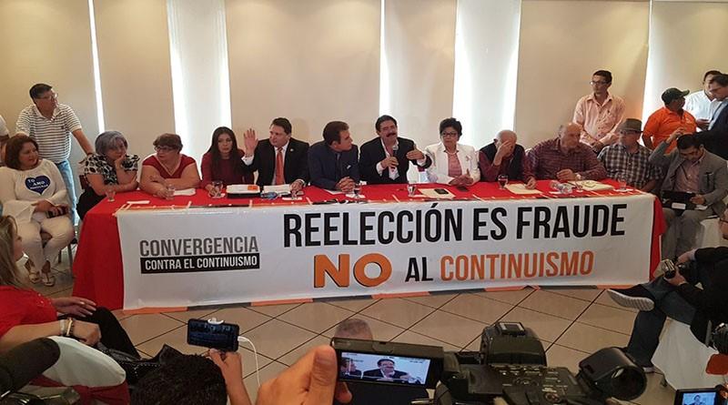 A group of people sitting at a table with a banner
AI-generated content may be incorrect.