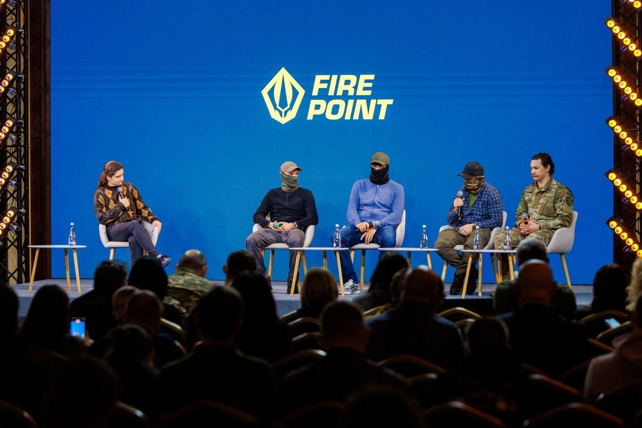 A group of people sitting on a stage

AI-generated content may be incorrect.