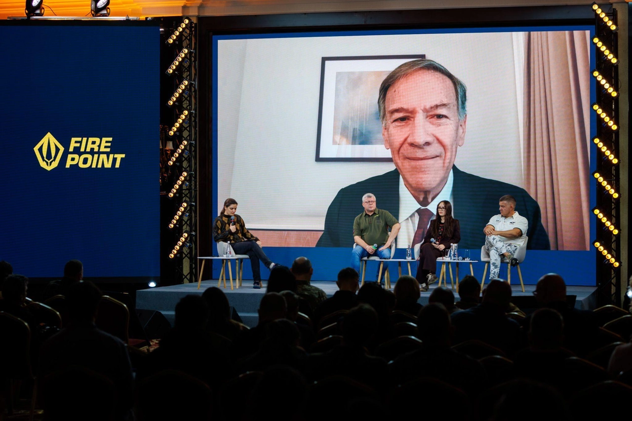 A group of people sitting on a stage

AI-generated content may be incorrect.