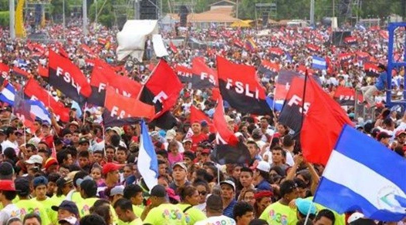 A large crowd of people holding flags

AI-generated content may be incorrect.