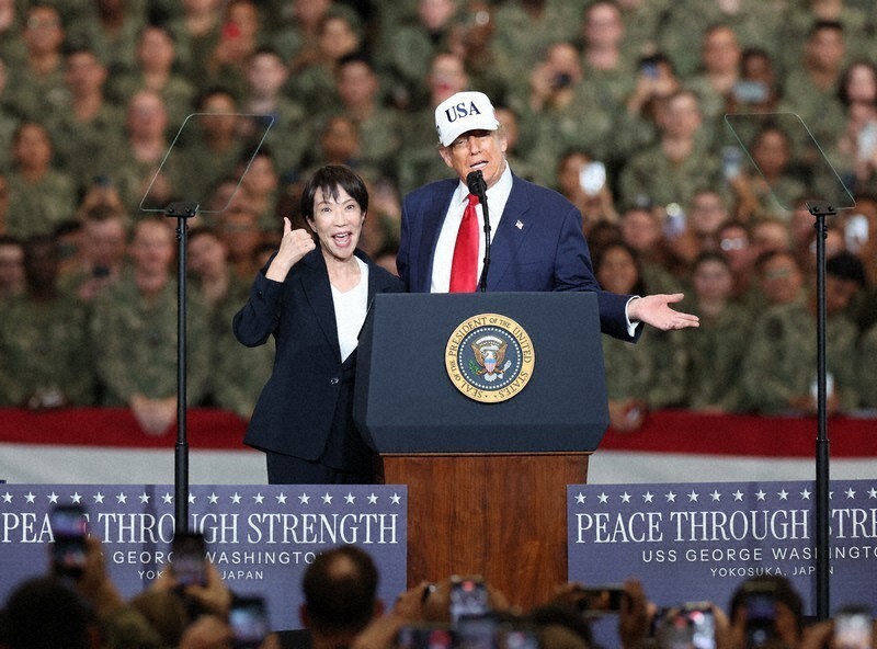 A person and person standing at a podium

AI-generated content may be incorrect.