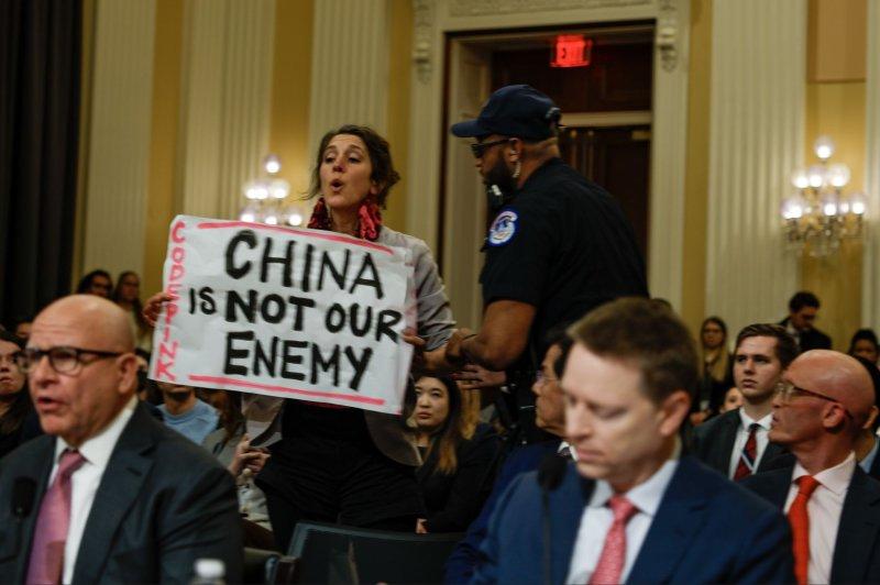 A person holding a sign

AI-generated content may be incorrect.