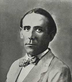 A person in a suit and bow tie

AI-generated content may be incorrect.