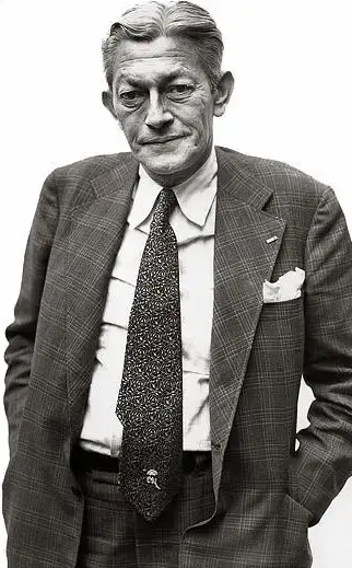 A person in a suit and tie

AI-generated content may be incorrect.