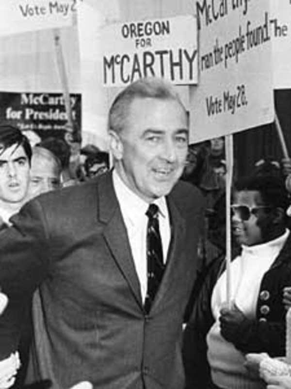 A person in a suit and tie holding signs

AI-generated content may be incorrect.