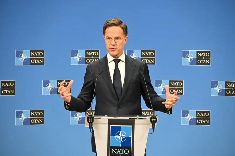 A person in a suit standing at a podium

AI-generated content may be incorrect.