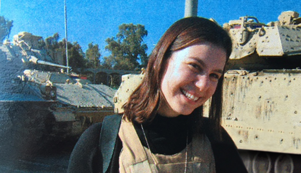 A person smiling at camera AI-generated content may be incorrect.