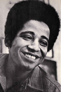 A person smiling with afro hair

AI-generated content may be incorrect.