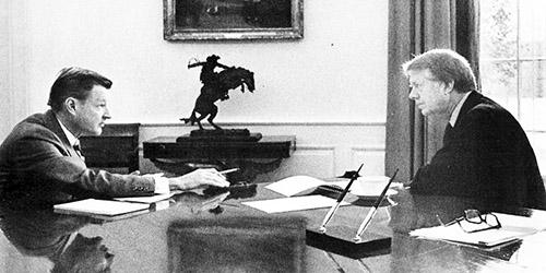 A person writing on a desk

AI-generated content may be incorrect.