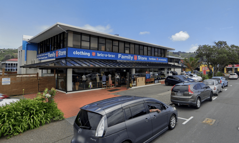 A car parked in front of a store
Description automatically generated