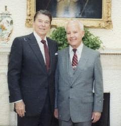 A couple of men in suits

AI-generated content may be incorrect.