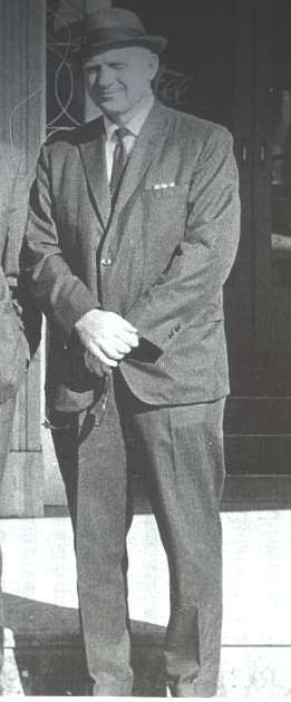 A person in a suit

AI-generated content may be incorrect.