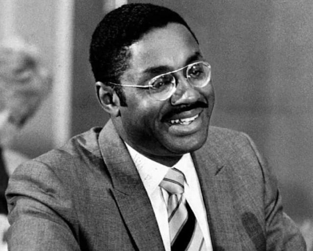 A person in a suit and tie

AI-generated content may be incorrect.