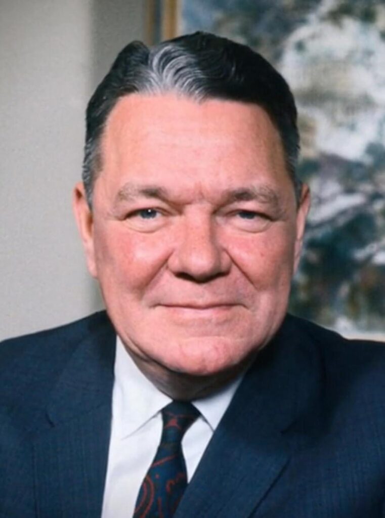 A person in a suit and tie

AI-generated content may be incorrect.