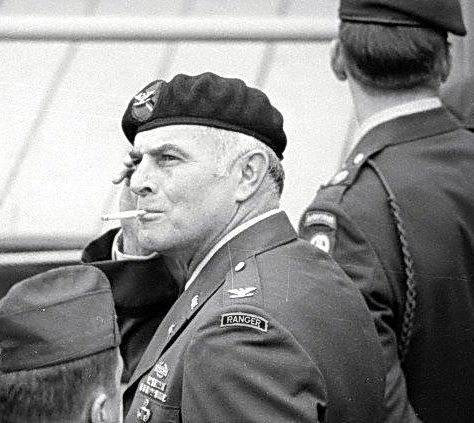A person in military uniform smoking a cigarette
AI-generated content may be incorrect.